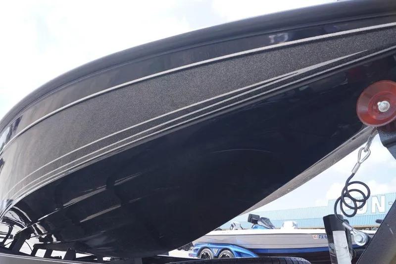 Slide: The Image of Close-up of 2026 Phoenix 921 Elite X boat hull on trailer. - 7