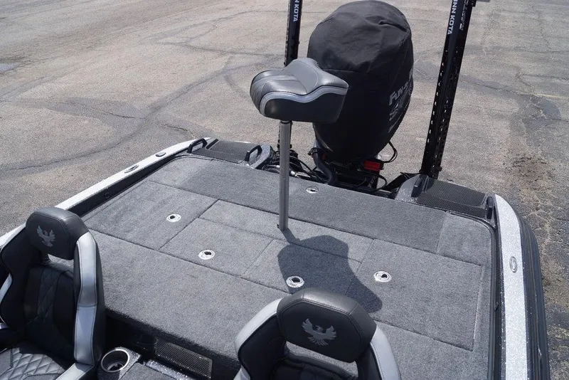 Slide: The Image of 2026 Phoenix 921 Elite X boat deck with seating and motor, featuring a sleek design. - 9