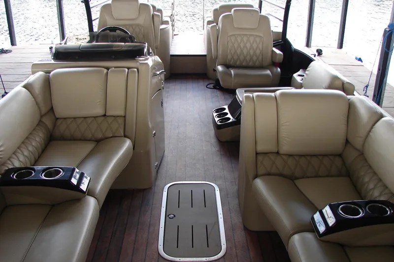 Slide: The Image of Luxurious interior of 2015 Bennington 2875 QCW I/O pontoon boat with plush seating. - 13