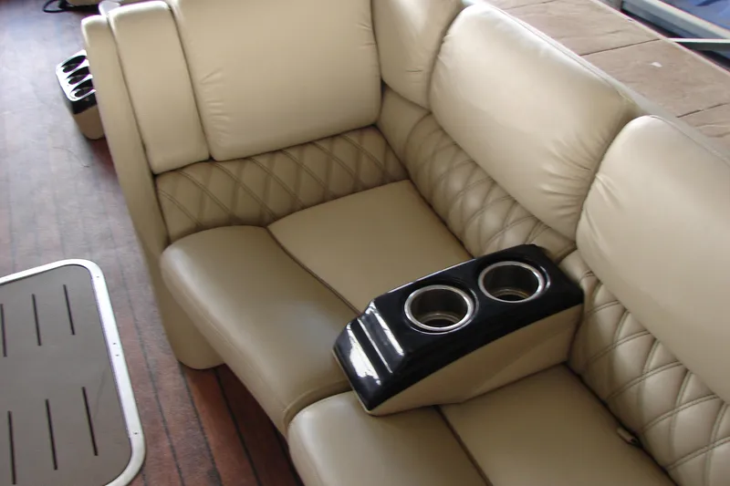 Slide: The Image of Luxurious beige seating with cup holders on a 2015 Bennington 2875 QCW I/O boat. - 14