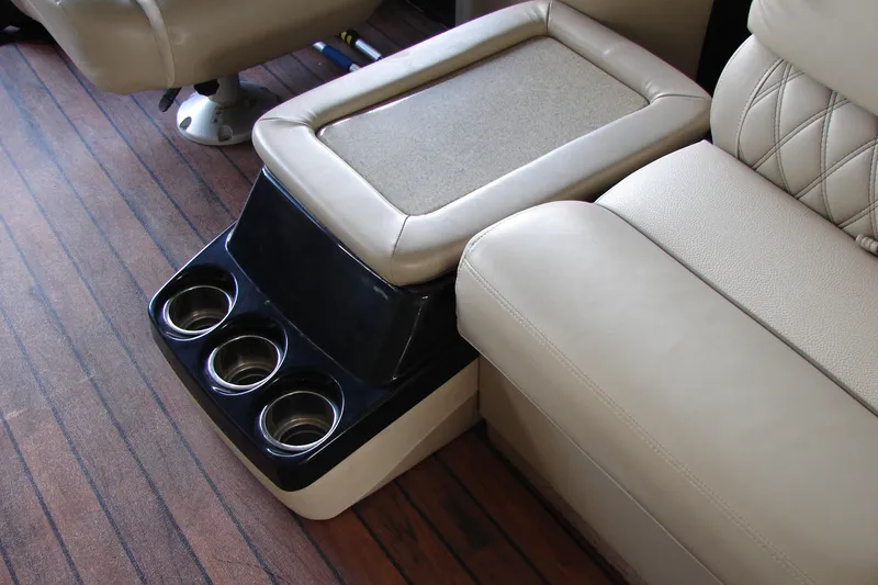 Slide: The Image of Luxurious seating with cup holders on a 2015 Bennington 2875 QCW I/O boat. - 15