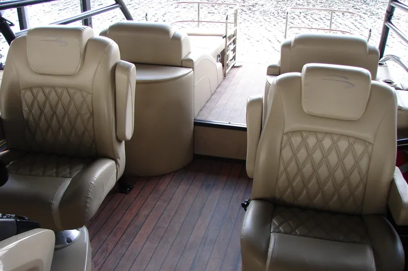 Slide: The Image of Luxurious interior of 2015 Bennington 2875 QCW I/O boat with plush seating. - 16