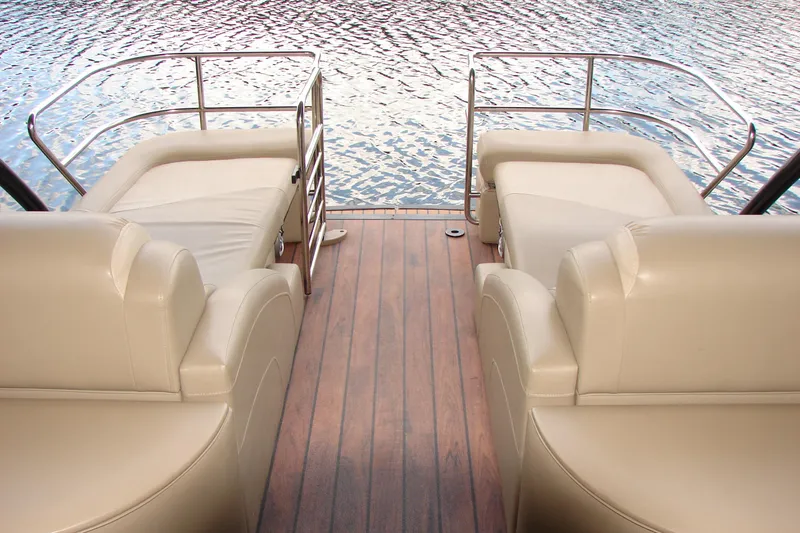 Slide: The Image of Luxurious seating on 2015 Bennington 2875 QCW I/O boat with water view. - 17