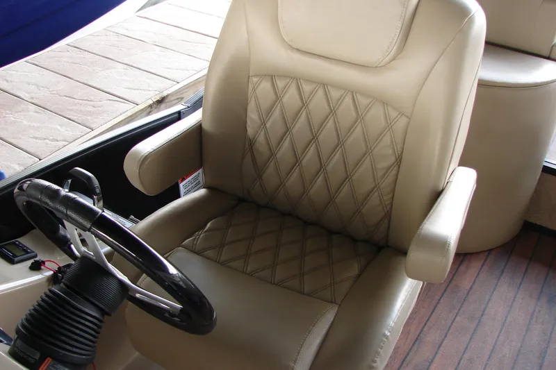 Slide: The Image of Captain's chair on 2015 Bennington 2875 QCW I/O boat with diamond-stitched upholstery. - 21