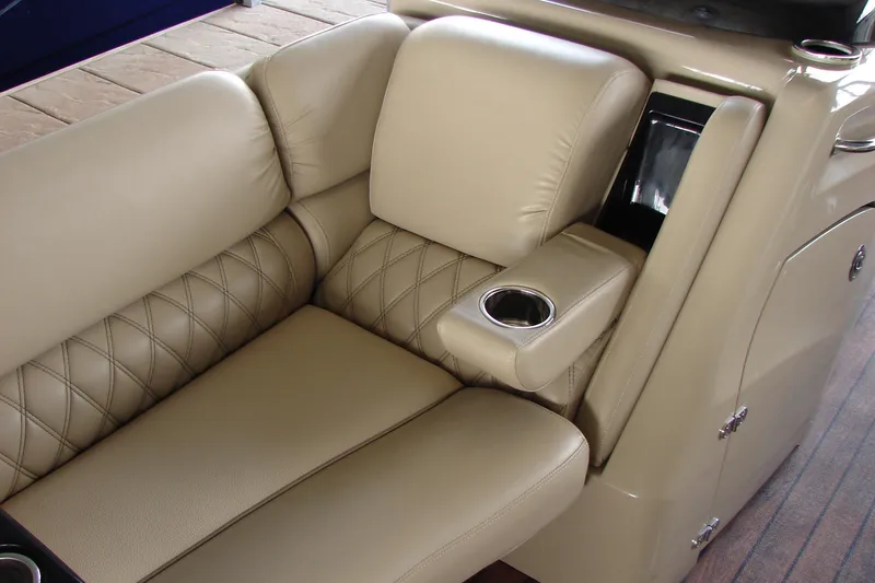 Slide: The Image of Luxurious beige seating with cup holder on 2015 Bennington 2875 QCW I/O boat. - 27