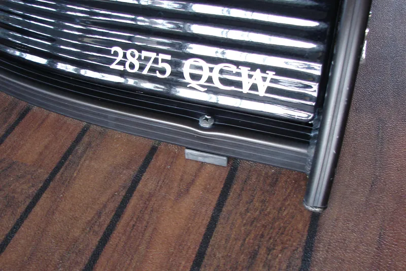 Slide: The Image of 2015 Bennington 2875 QCW I/O boat detail with wood-textured flooring. - 29