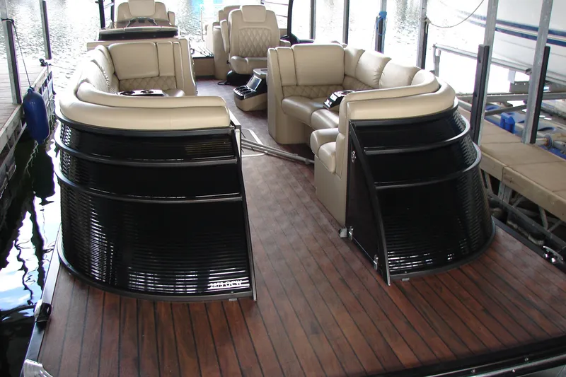 Slide: The Image of 2015 Bennington 2875 QCW I/O pontoon boat with luxurious seating and wooden deck. - 3