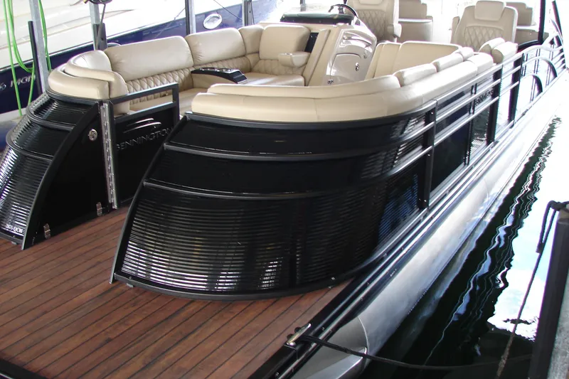 Slide: The Image of 2015 Bennington 2875 QCW I/O pontoon boat with luxurious seating and sleek design. - 30