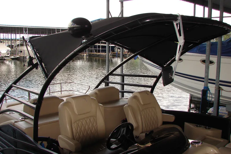 Slide: The Image of 2015 Bennington 2875 QCW I/O boat with canopy, docked in marina. - 5