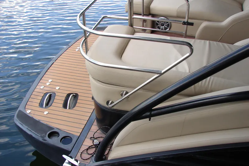 Slide: The Image of 2015 Bennington 2875 QCW I/O boat with teak deck and beige seating. - 7