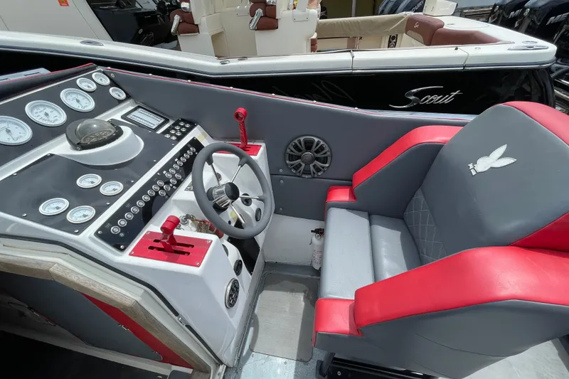 Slide: The Image of Cockpit of a 1994 Cigarette 38' Top Gun GT with red and gray seating. - 20