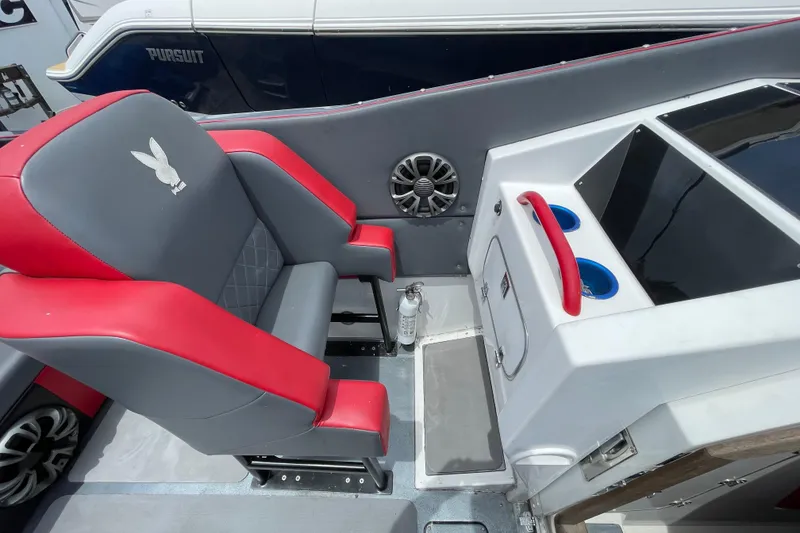 Slide: The Image of Interior of 1994 Cigarette 38' Top Gun GT with red and gray seating. - 21