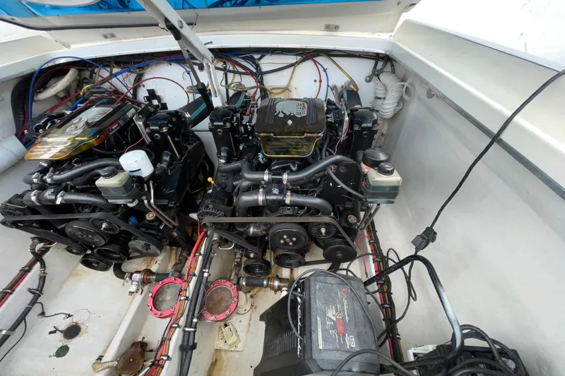 Slide: The Image of Engine compartment of a 1994 Cigarette 38' Top Gun GT boat, showcasing dual engines. - 39