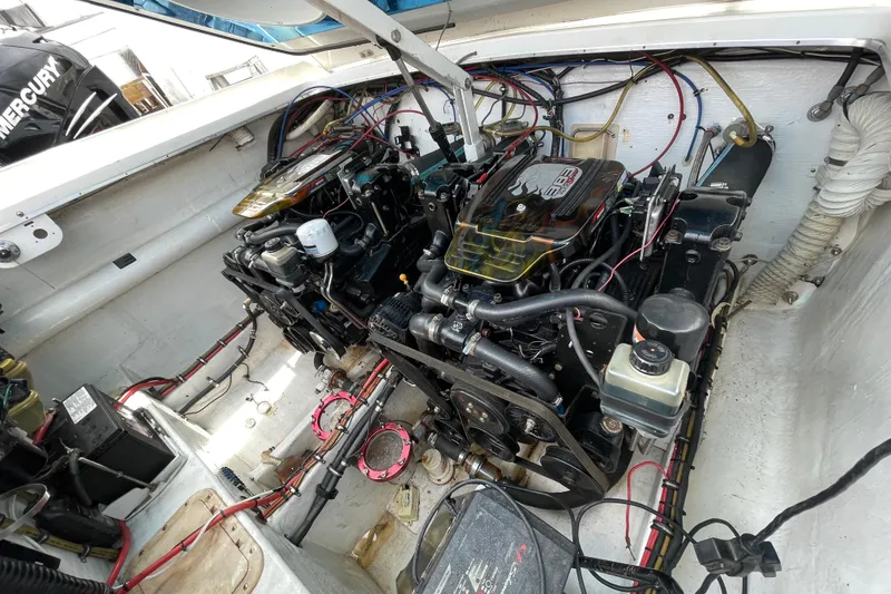Slide: The Image of Engine compartment of a 1994 Cigarette 38' Top Gun GT boat, showcasing dual engines. - 41