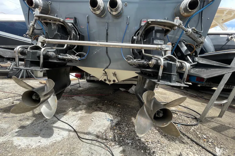 Slide: The Image of Rear view of a 1994 Cigarette 38' Top Gun GT boat with dual propellers. - 42