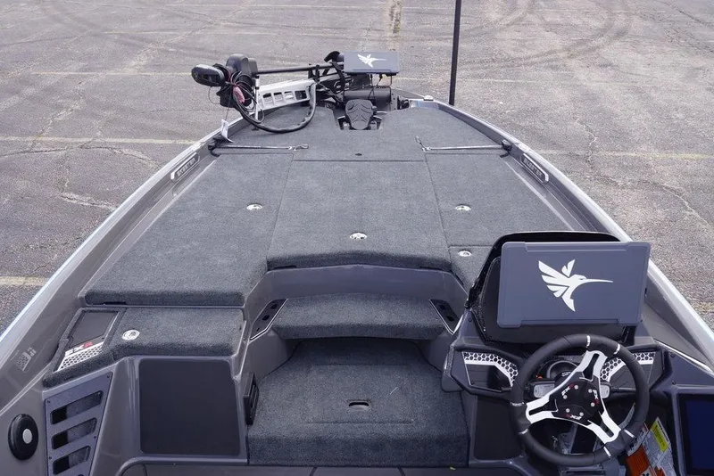 Slide: The Image of 2026 Skeeter FXR20 PRO boat interior with steering wheel and control panel. - 12