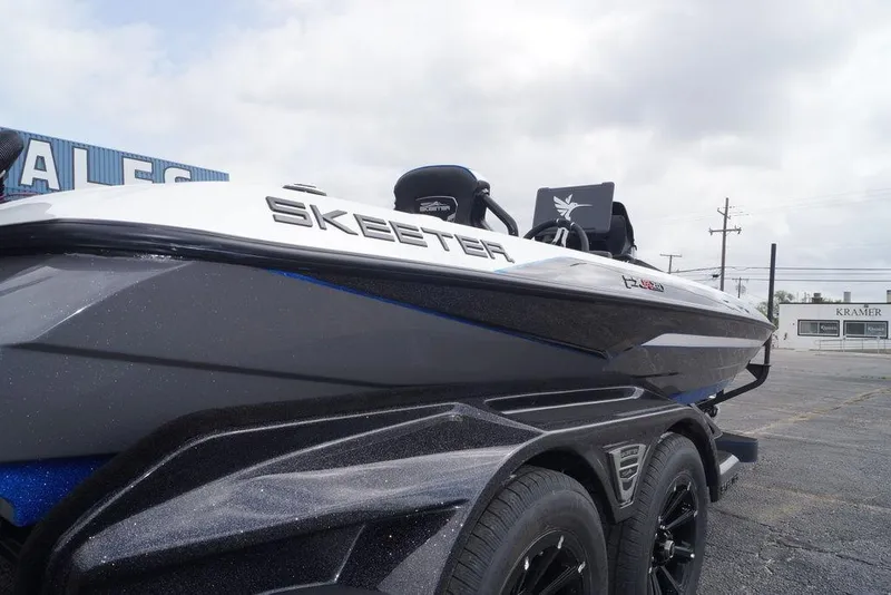 Slide: The Image of 2026 Skeeter FXR20 PRO boat on trailer, showcasing sleek design and branding. - 15