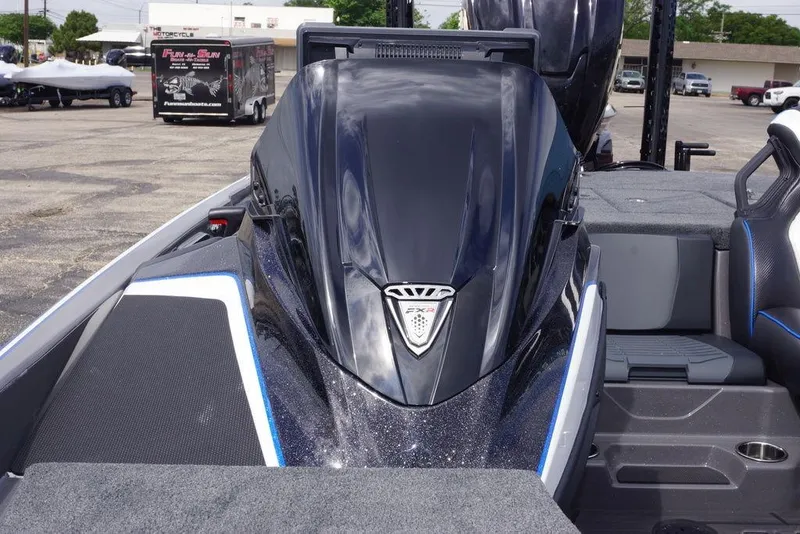 Slide: The Image of 2026 Skeeter FXR20 PRO boat, sleek design, parked outdoors. - 22