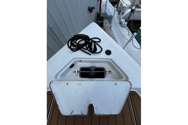 Slide: The Image of Bow of 2017 Bulls Bay 2200 boat with open hatch and coiled rope. - 14
