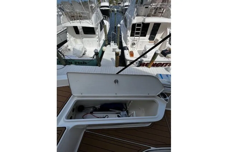 Slide: The Image of Open storage compartment on 2017 Bulls Bay 2200 boat at marina. - 15