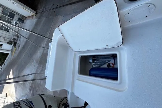 Slide: The Image of 2017 Bulls Bay 2200 boat storage compartment with open hatch, showcasing interior space. - 18