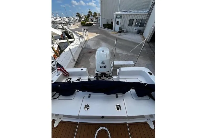 Slide: The Image of 2017 Bulls Bay 2200 boat with Suzuki 150 engine at marina dock. - 19