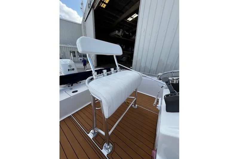 Slide: The Image of 2017 Bulls Bay 2200 boat seat with white upholstery and stainless steel frame. - 6
