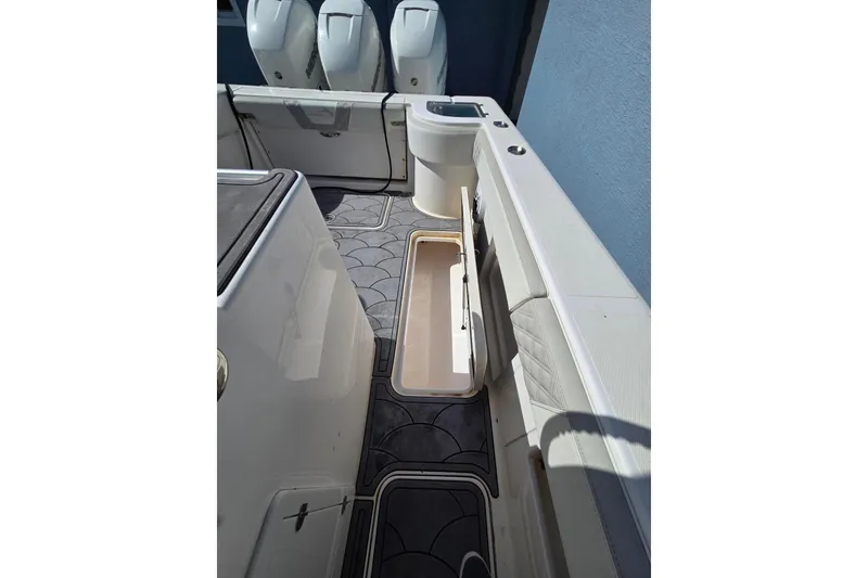 Slide: The Image of 2021 Streamline 35 CC boat with triple Mercury 350 engines on calm water. - 10