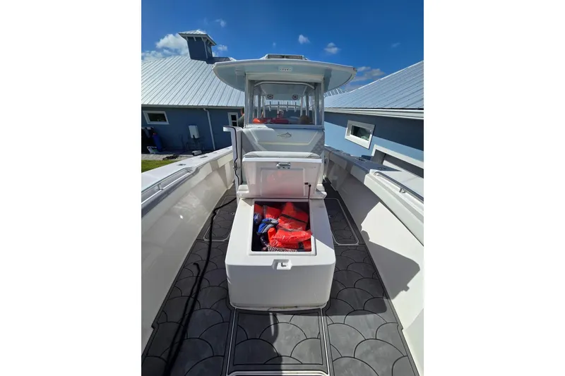 Slide: The Image of 2021 Streamline 35 CC boat cockpit with advanced navigation displays and controls. - 16