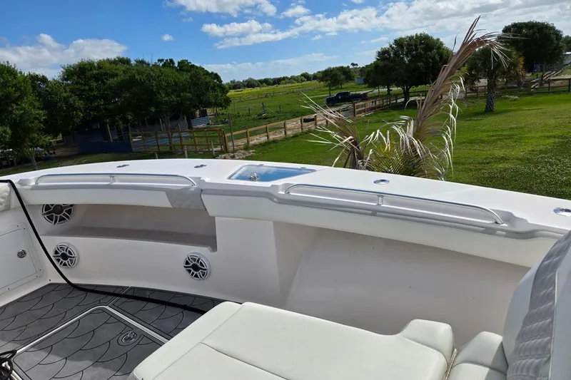 Slide: The Image of Center console of 2021 Streamline 35 CC boat with navigation screens and steering wheel. - 18