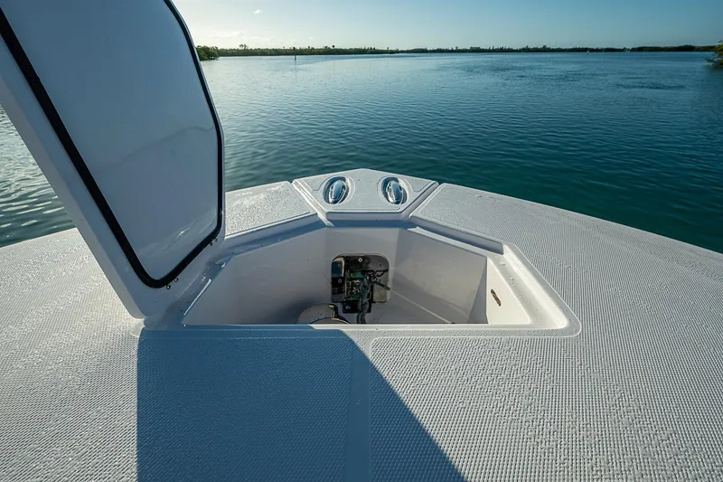 Slide: The Image of 2021 Streamline 35 CC boat with open hatch on calm water. - 26