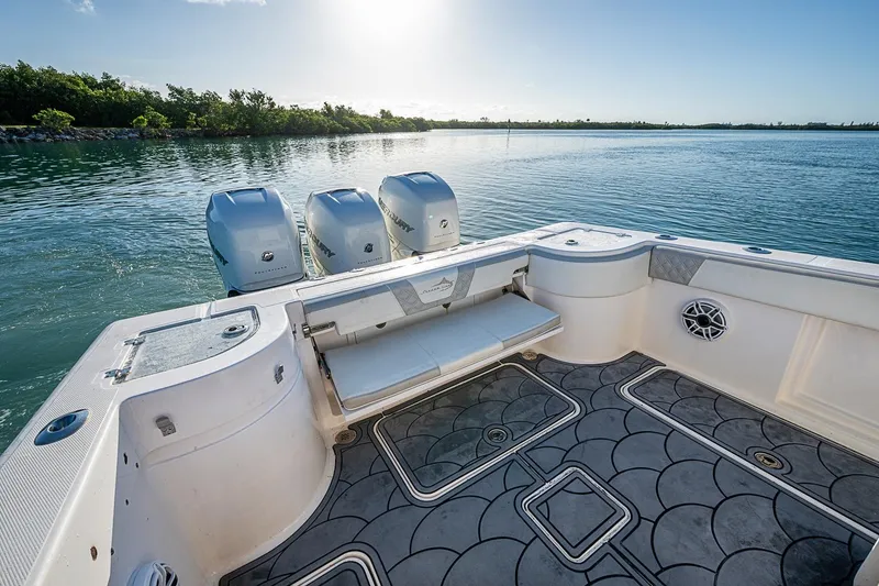 Slide: The Image of 2021 Streamline 35 CC boat with triple engines on calm water. - 31