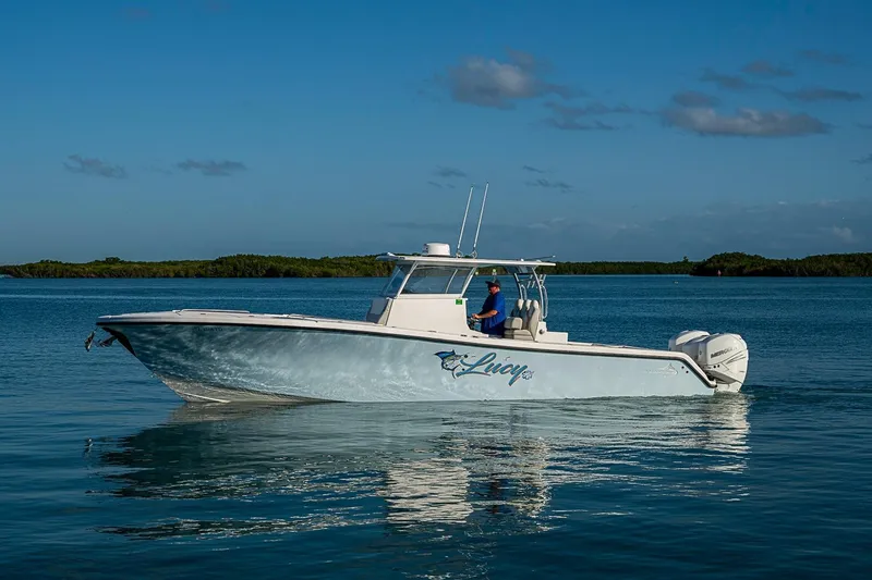 Slide: The Image of 2021 Streamline 35 CC boat cruising on calm blue waters. - 40