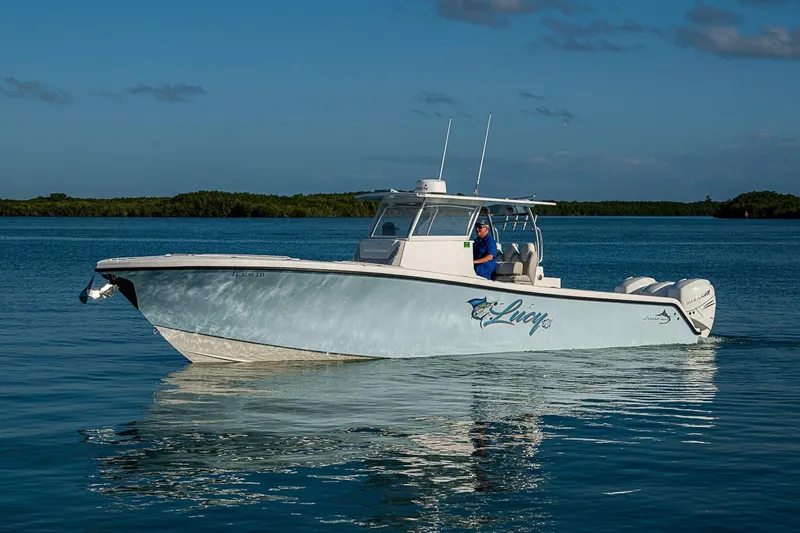 Slide: The Image of 2021 Streamline 35 CC boat cruising on calm blue waters. - 41