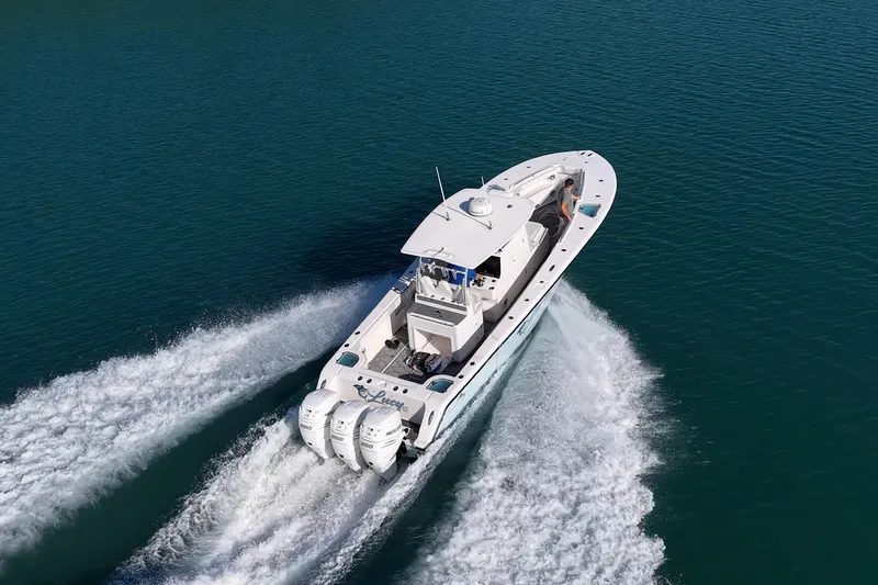 Slide: The Image of Aerial view of 2021 Streamline 35 CC boat cruising on open water. - 43