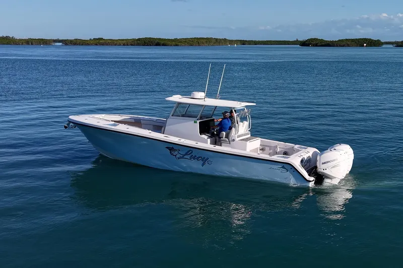 Slide: The Image of 2021 Streamline 35 CC boat cruising on calm blue waters. - 45