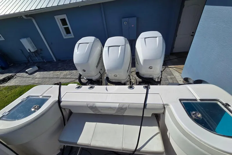 Slide: The Image of 2021 Streamline 35 CC boat on calm water, clear sky background. - 5