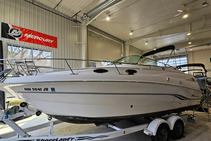 The Image of 2001 Chaparral Signature 240 boat on trailer in indoor showroom. - 1