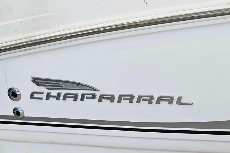Slide: The Image of 2001 Chaparral Signature 240 boat logo on white hull with chrome accents. - 22