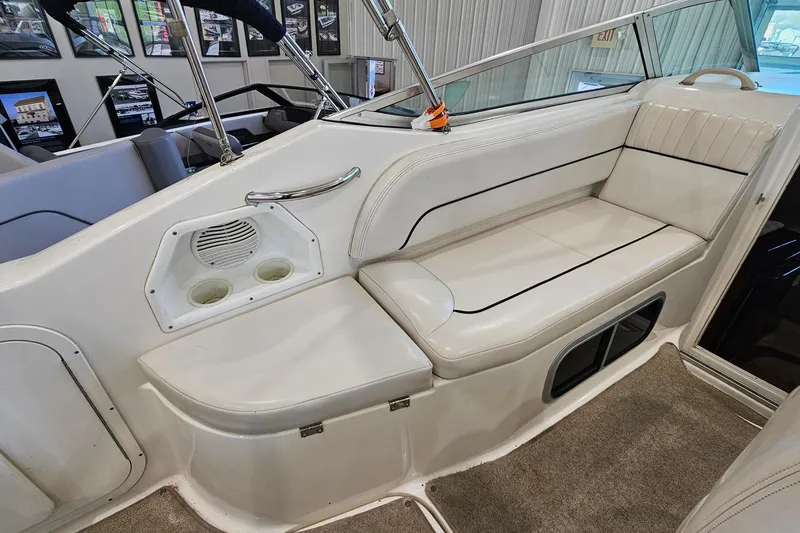 Slide: The Image of 2001 Chaparral Signature 240 boat interior with white seating and cup holders. - 8