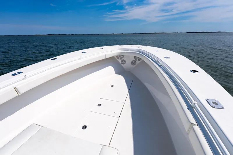 Slide: The Image of 2019 Onslow Bay 33 Tournament boat on calm water under a clear blue sky. - 19