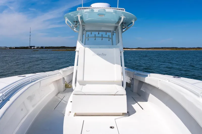 Slide: The Image of 2019 Onslow Bay 33 Tournament boat on open water under clear blue sky. - 21