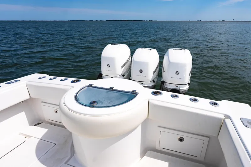 Slide: The Image of 2019 Onslow Bay 33 Tournament boat with triple Mercury engines on open water. - 25