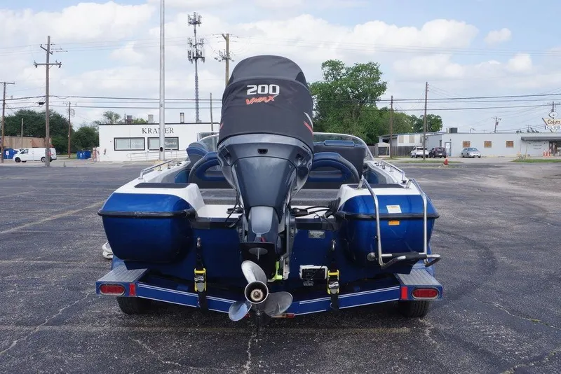 Slide: The Image of 2007 Skeeter SL 210 boat with Yamaha VMAX 200 engine in parking lot. - 10