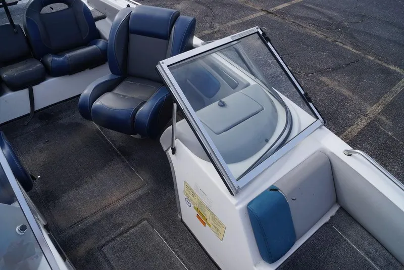 Slide: The Image of 2007 Skeeter SL 210 boat interior with blue and gray seating. - 14