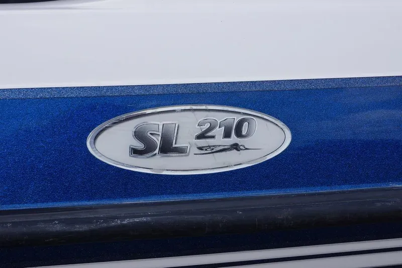 Slide: The Image of 2007 Skeeter SL 210 boat emblem on blue and white surface. - 17