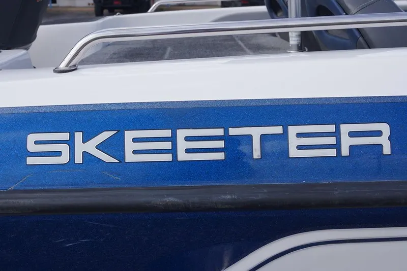 Slide: The Image of 2007 Skeeter SL 210 boat with blue and white exterior detailing. - 4