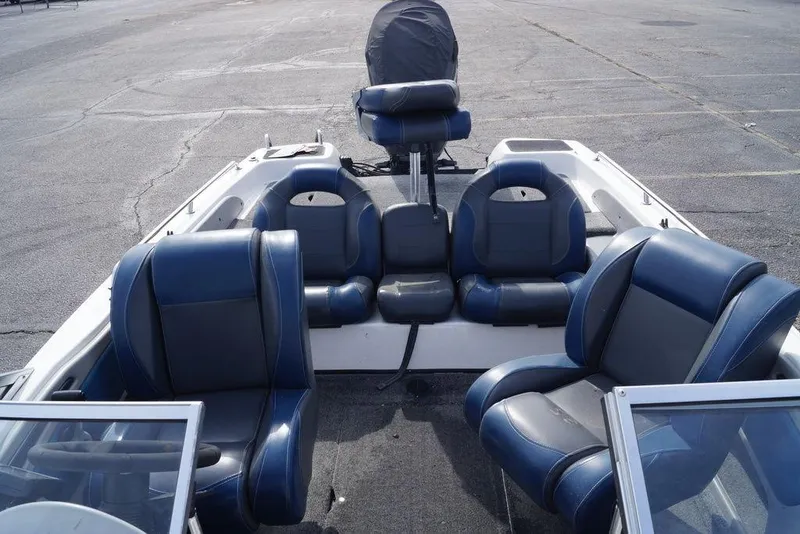 Slide: The Image of 2007 Skeeter SL 210 boat interior with blue and gray seating arrangement. - 5