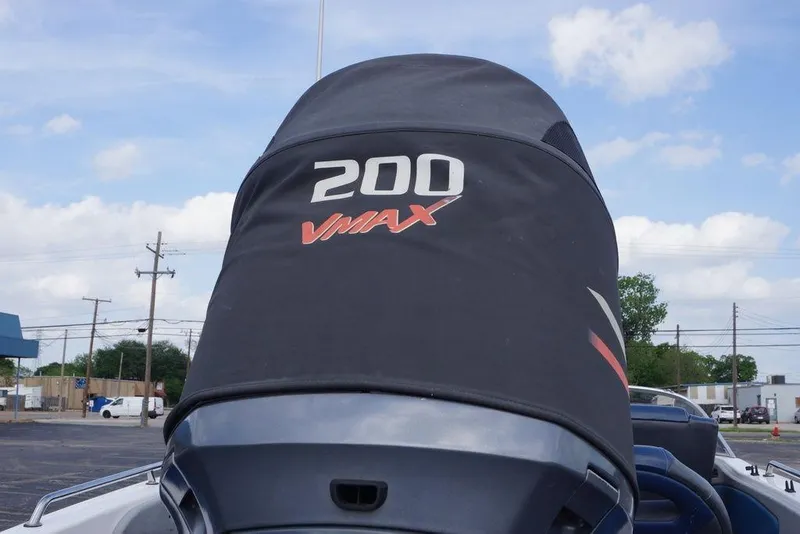 Slide: The Image of 2007 Skeeter SL 210 boat with VMAX 200 engine cover, outdoor setting. - 9