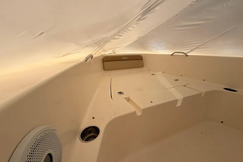 Slide: The Image of Interior view of 2020 Scout 195 Sportfish boat, featuring seating and storage compartments. - 14